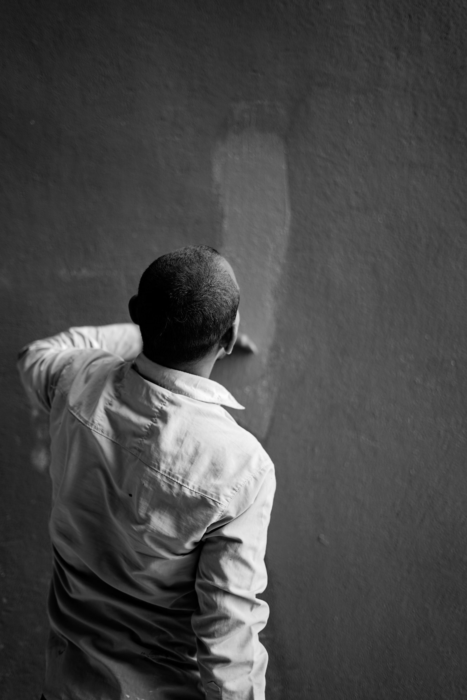 Technician plastering a wall