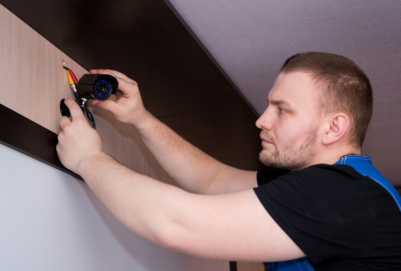 Carpenter installing a cabinet