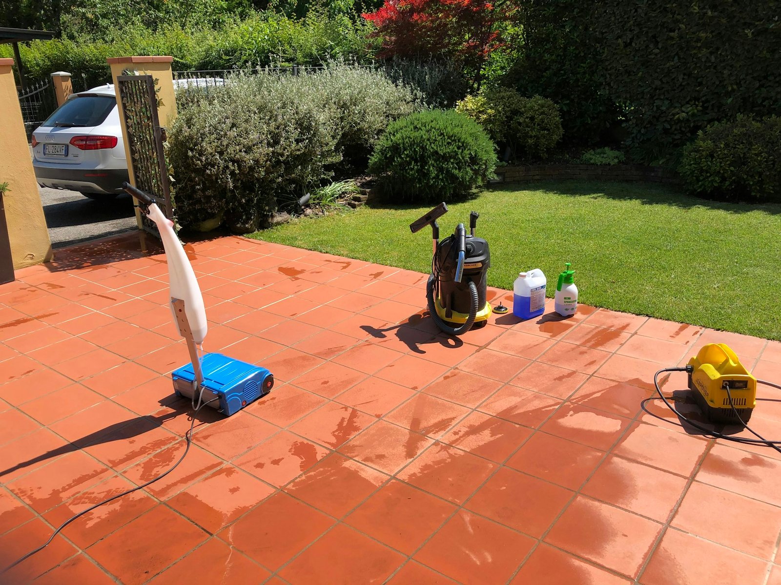 Pressure washing an outdoor tiled area
