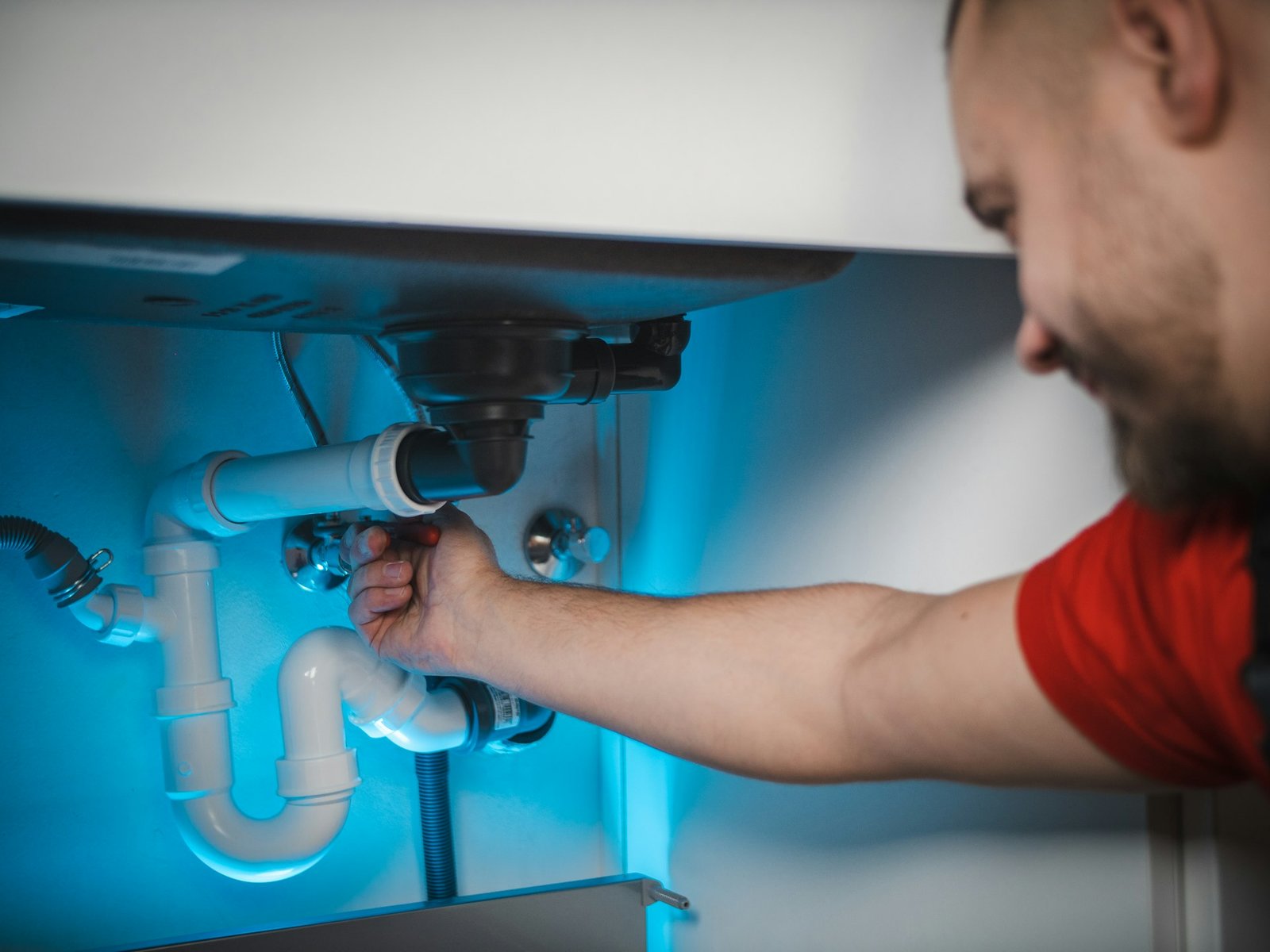 Professional plumber fixing pipes in Dubai home