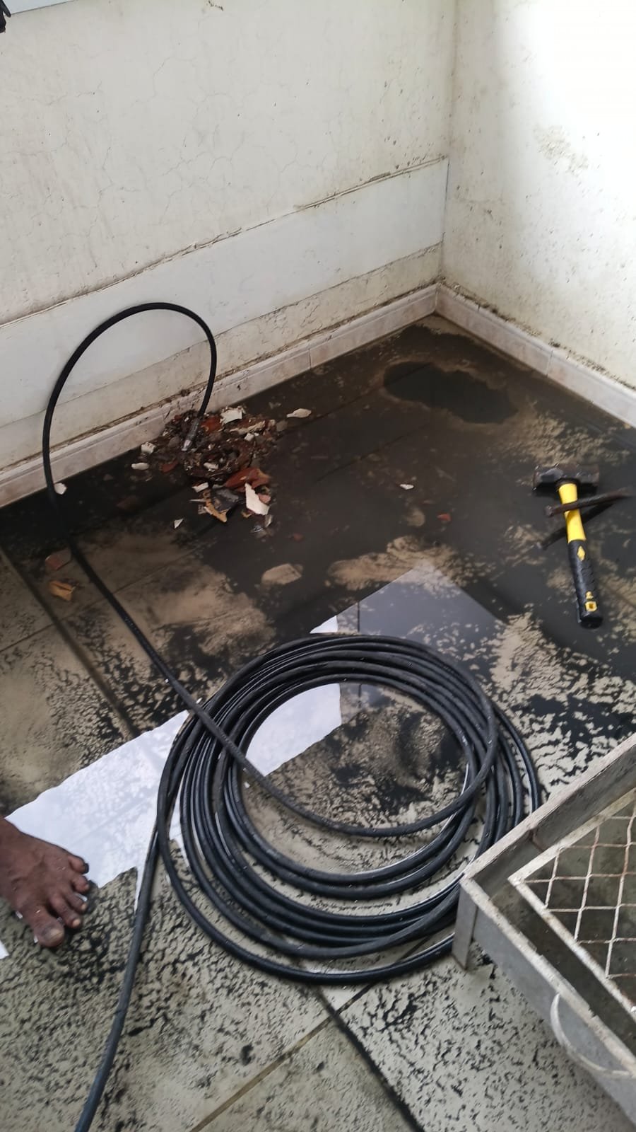 Technician performing drain cleaning