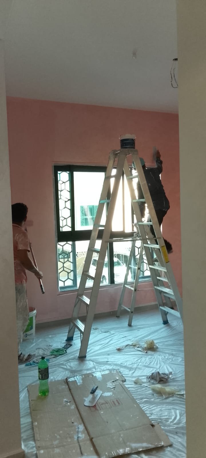 Interior painting services in Dubai with pink accent wall