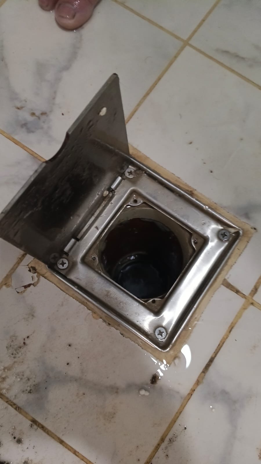 Floor drain plumbing repair in a Dubai bathroom